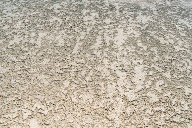 Yakın plan, dekoratif bej alçı cephesinin dokusu