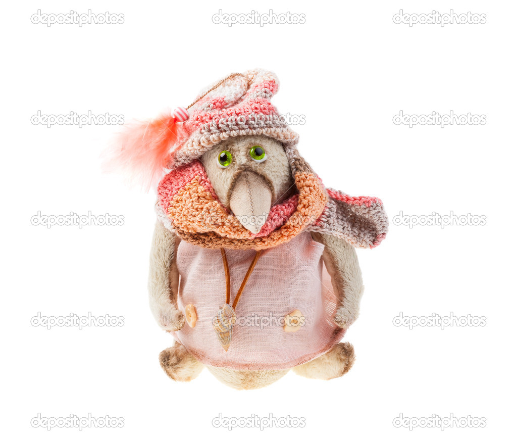 Plush bird with a knitted scarf and hat