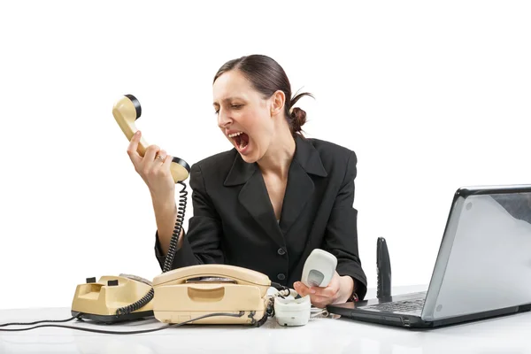 Business woman screaming into the phone — Stock Photo, Image