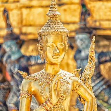 Golden Kinnara Statue at Emerald Buddha temple in the Grand Palace of Bangkok