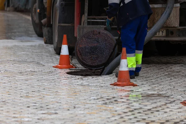 Drain cleaning, sewage truck pumping out contaminated wate