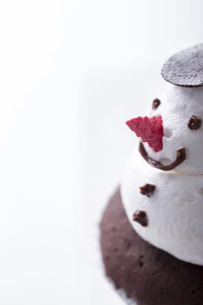 Close up of snowman cupcake on white background — Stock Photo, Image