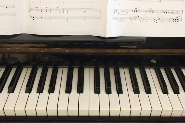 stock image Piano keyboard and score