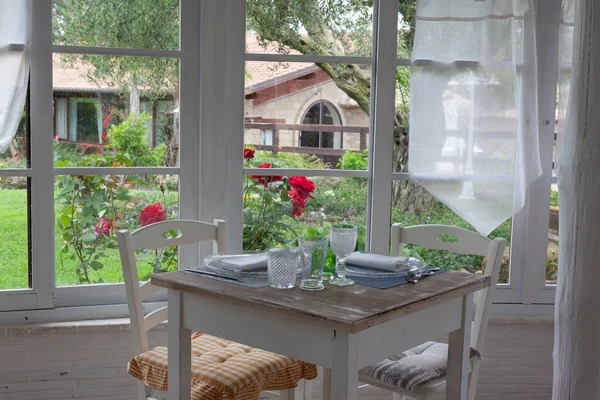 lunch set table in a bay window