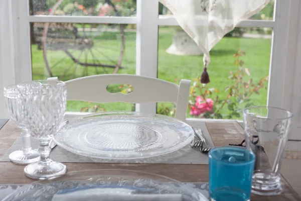 lunch set table in a bay window