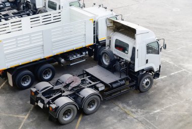 Heads of white semi trailer trucks