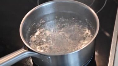 4K Closeup in pot of boiling water