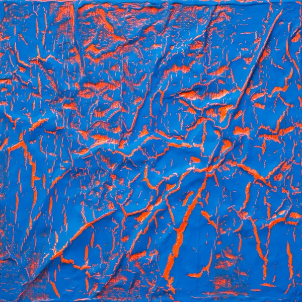 Текстурная краска, трещина оранжево-голубой поверхности — стоковое фото