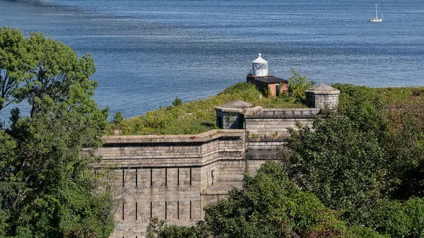 The Fort Wadsworth Light, a squat red brick lighthouse sits at the entrance to New York harbor in Staten Island, New York.