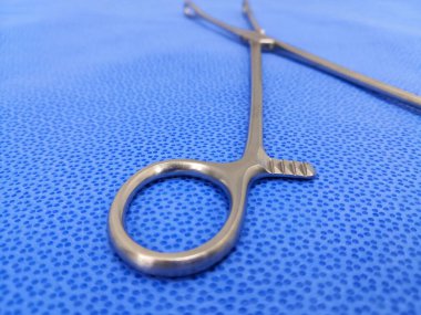 Closeup Image Of Surgical Sponge Holder Holding Ring. Selective Focus