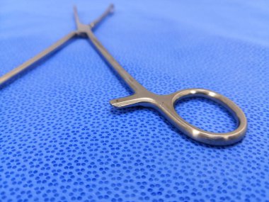 Closeup Image Of Surgical Sponge Holder Holding Ring. Selective Focus