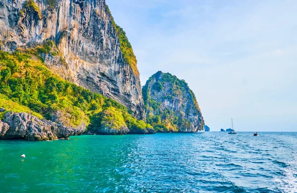 stock image The yacht trip along the coast of Chicken Island (Koh Kai) with a view on azure waters of Andaman sea, fast floating longtail boat and Koh Poda Island on the foreground, Ao Nang, Krabi, Thailand