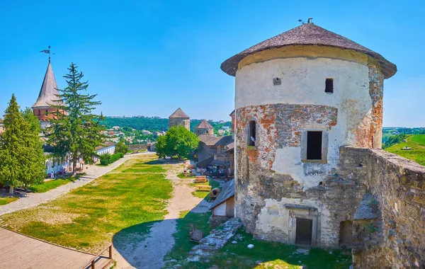 The courtyard and parade grounds of medieval Kamianets-Podilskyi Castle with preserved towers, buildings and ramparts, Ukraine