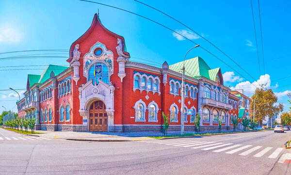 The splendid former building of Russian Peasant Bank, decorated with wall sculptures, moulding and mosaics in Poltava, Ukraine