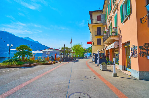 Enjoy the walk down Riva dal Garavell embankment of Lake Lugano, Morcote, Switzerland