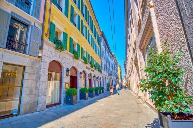 MILAN, ITALY - APRIL 5, 2022: Via della Spiga is a part of Fashion district of Milan with exclusive boutiques and jewelers, on April 5 in Milan, Italy