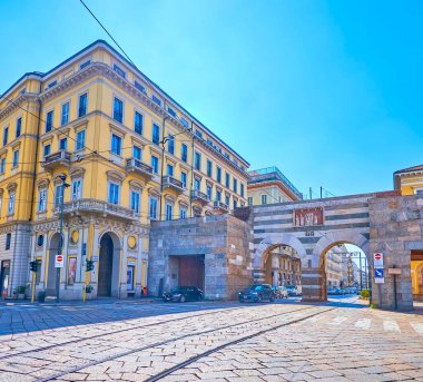 MILAN, ITALY - APRIL 5, 2022: The Arch of Porta Nouva gates, the medieval remains of city's walls, located in historical part of the city, on April 5 in Milan, Italy