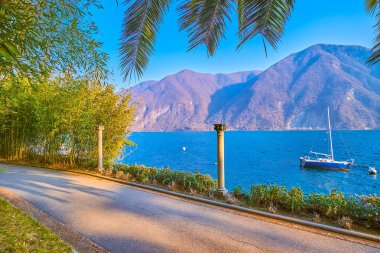 Tropik bitkilerle dolu Villa Heleneum halk parkı, İsviçre 'nin Lugano şehrinde akşam vaktini geçirmek için en romantik yerlerden biridir.