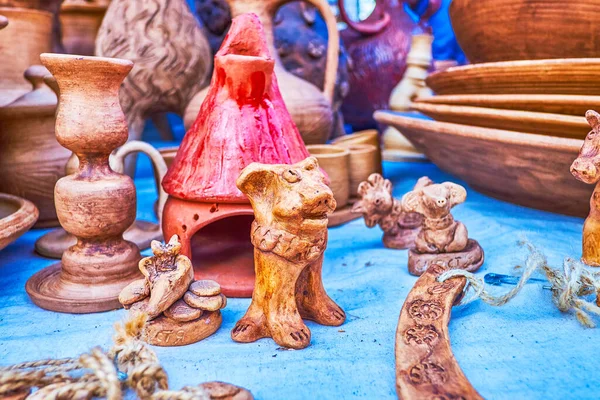 Traditional clay kid's toys in form of different animals on market of National Sorochynsky Fair, Sorochyntsi, Ukraine