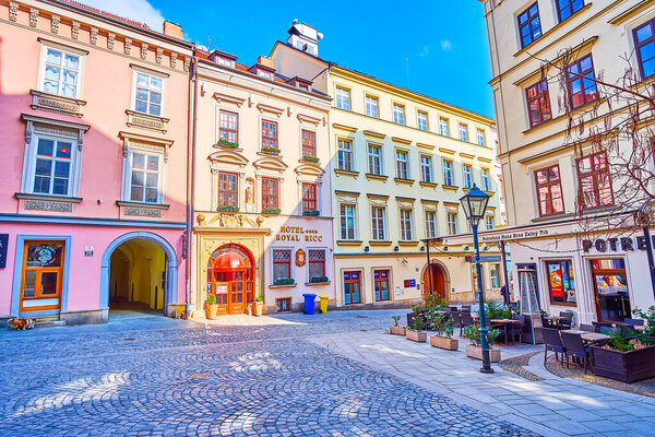 BRNO, CZECH REPUBLIC - MARCH 10, 2022: The pleasant stroll along historic neighborhood observing old facades with numerous cafes and shops, on March 10 in Brno, Czech Republic