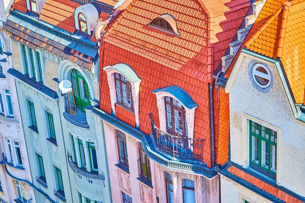 The scenic balconies with red tiled roofs of historic residential houses in old town of Brno, Czech Republic