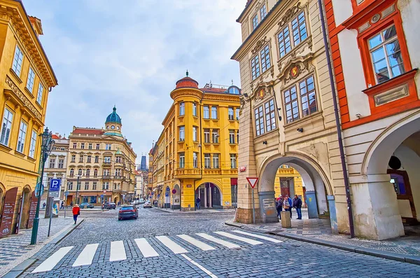 Explore historic Mala Strana neighborhood and walk down among the colored buildings of Malostranske (Lesser Quarter) Square, Prague, Czech Republic