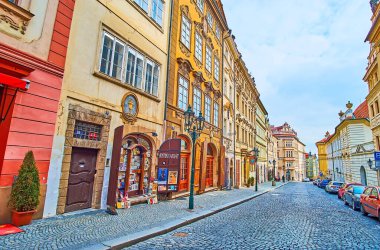 PRAGUE, CZECH REPUBLIC - MARCH 6, 2022: Walk down Nerudova Street and watch elegant historic houses with souvenir stores and tourist cafes, on March 6 in Prague