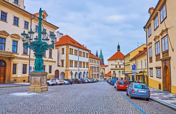 Historic architectural ensemble of Loretanska Street with medieval mansions and vintage Candelabra gaslight lamppost, Hradcany, Prague, Czech Republic