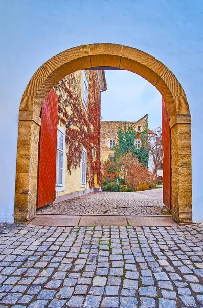The medieval stone gate, leading to the small garden and residential houses of Lesser Quarter, Prague, Czech Republic