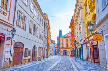 PRAGUE, CZECH REPUBLIC - MARCH 6, 2022: Celetna Street with historic houses, shops, cafes and a view on Powder Tower, on March 6 in Prague