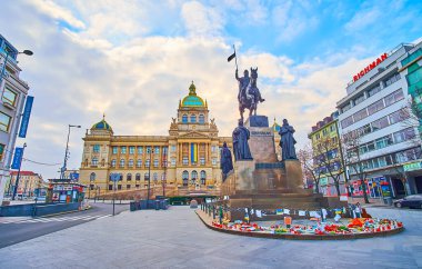 PRAGUE, CZECH REPUBLIC - MARCH 6, 2022: Historic and modern housing of Wenceslas Square with St Wenceslas monument and building of National Museum, on March 6 in Prague