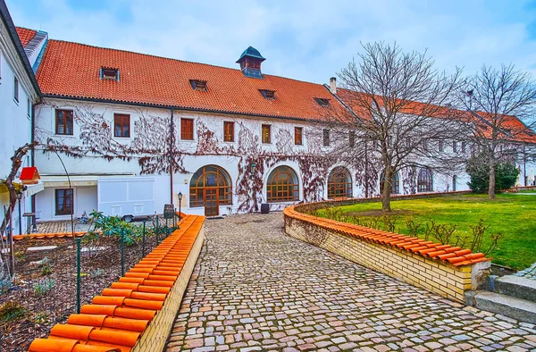 The scenic garden and restore monastic buildings of Strahov Monastery in Hradcany, Prague, Czech Republic