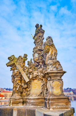 Historic statue of Madonna and St Bernard on the medieval Charles Bridge across Vltava River, Prague, Czech Republic