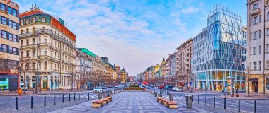 PRAGUE, CZECH REPUBLIC - MARCH 6, 2022: Panorama of architectural landmarks of Wenceslas Square with sotres, cafes, restaurants and museums, on March 6 in Prague
