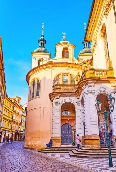 Exterior of St Clement Cathedral with sculptures, stucco decorations and tall bell towers, KArlova Street, Prague, Czech Republic