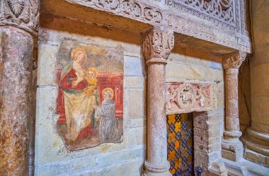 PAVIA, ITALY - APRIL 9, 2022: The medieval stone decoration at the entrance to the crypt in San Michele Maggiore Church, on April 9 in Pavia, Italy