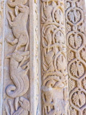 The fragment of the medieval stone carved decorations of San Michele Maggiore Church in Pavia, Italy