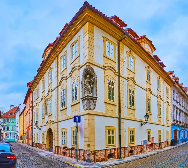 The corner of historic mansion, decorated with wall statue of St Florian, Nosticova Street, Mala Strana, Prague, Czech Republic