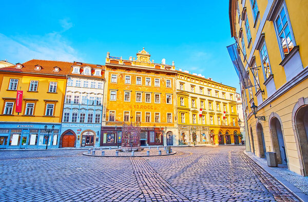 PRAGUE, CZECH REPUBLIC - MARCH 6, 2022: The beautiful mansions and frescoed U Rotta House on Little Square of Stare Mesto (Old Town) district, on March 6 in Prague