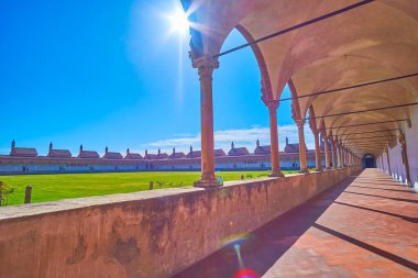 The scenic view on Grand Cloister of Certosa di Pavia with medieval arcades and monk's cells, Italy