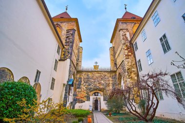 The stone gate of historic Johannite Monastery with Maltese Knights Garden in the foreground, Prague, Czech Republic
