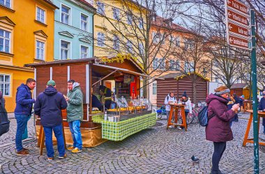 PRAGUE, CZECH REPUBLIC - MARCH 6, 2022: The stalls of the food market on Na Kampe Street of the Lesser Quarter, on March 6 in Prague