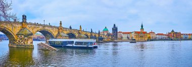 The Lesser Quarter embankment of Vltava River opens the view on Charles Bridge, Old Town Bridge Tower, Bedrich Smetana museum and Old Town Water Tower in background, Prague, Czech Republic