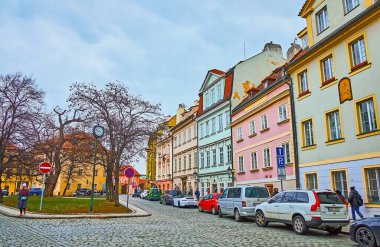 PRAGUE, CZECH REPUBLIC - MARCH 6, 2022: The small park amid the vintage houses of U Luzickeho Seminare Street of Lesser Quarter, on March 6 in Prague
