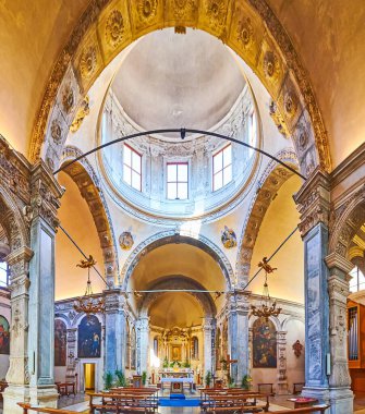 BRESCIA, ITALY - APRIL 10, 2022: Santa Maria dei Miracoli Church with inner dome, prayer hall, altar, icons, organ, on April 10 in Brescia