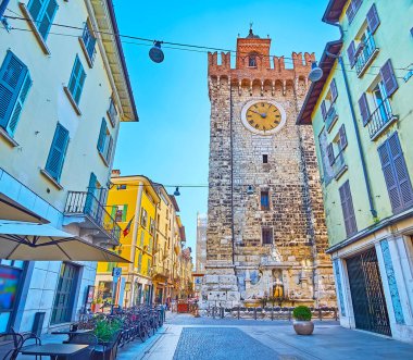 The tall stone Pallata Tower, located on the corner of Corso Goffredo Mameli and Via della Pace streets in old town of Brescia, Lombardy, Italy