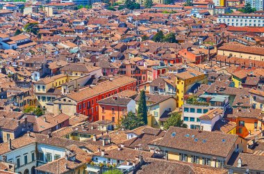 The red tile roofs of historic houses of Brescia, seen from Cidneo Hill viewing platform, Italy