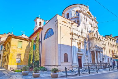 The richly decorated white stone facade of historic Santa Maria dei Miracoli Church, Brescia, Lombardy, Italy