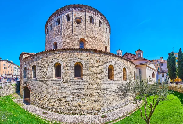 Panorama of the medieval stone Old Cathedral, massive dome of New Cathedral, Via Trieste street and colored housing of Piazza Paolo VI, Brescia, Lombardy, Italy