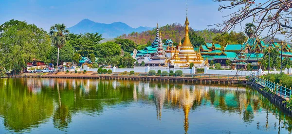 Panorama of Nong Kham Lake with Wat Chong Kham and Wat Chong Klang Burmese style temples, reflecting on the lake's surface, Mae Hong Son, Thailand